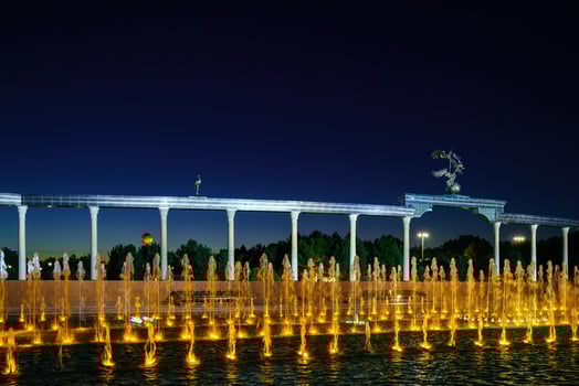 Memorial and rows of fountains with illumination in the Independence Square at summertime in nighttime, Tashkent, Uzbekistan. photo
