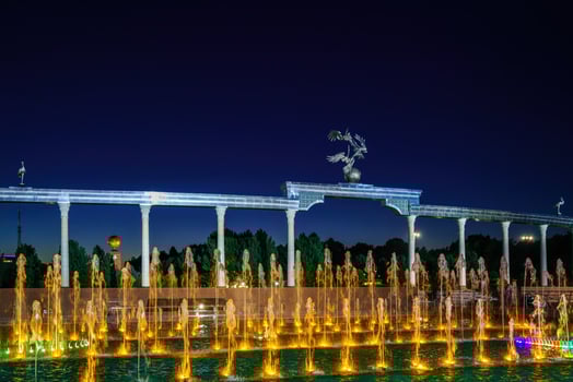 Memorial and rows of fountains with illumination in the Independence Square at summertime in nighttime, Tashkent, Uzbekistan. photo