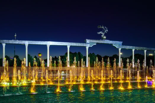 Memorial and rows of fountains with illumination in the Independence Square at summertime in nighttime, Tashkent, Uzbekistan. photo