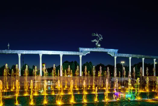 Memorial and rows of fountains with illumination in the Independence Square at summertime in nighttime, Tashkent, Uzbekistan. photo