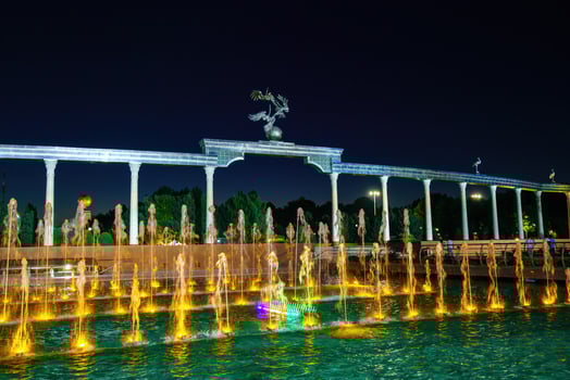 Memorial and rows of fountains with illumination in the Independence Square at summertime in nighttime, Tashkent, Uzbekistan. photo