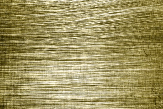 Golden texture of shiny scratched metal. Abstract gold background. photo