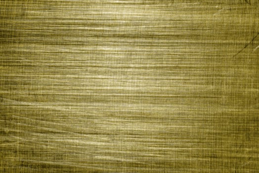 Golden texture of shiny scratched metal. Abstract gold background. photo