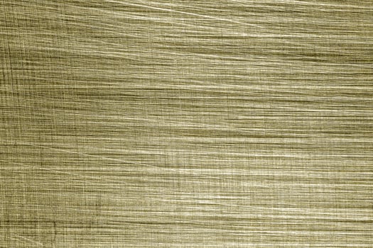 Golden texture of shiny scratched metal. Abstract gold background. photo