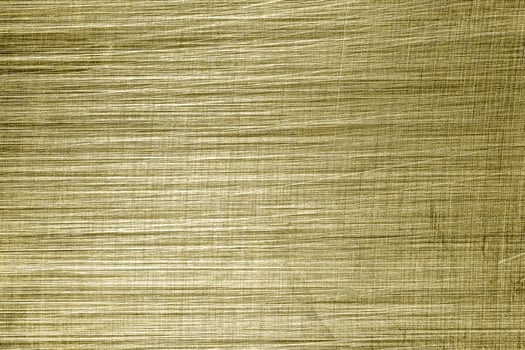Golden texture of shiny scratched metal. Abstract gold background. photo