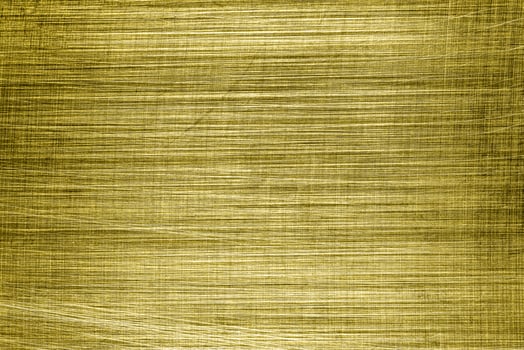 Golden texture of shiny scratched metal. Abstract gold background. photo