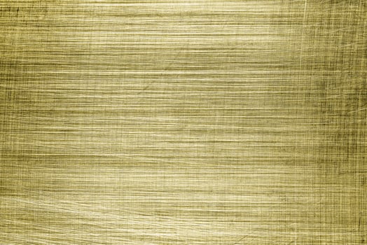 Golden texture of shiny scratched metal. Abstract gold background. photo