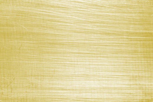 Golden texture of shiny scratched metal. Abstract gold background. photo