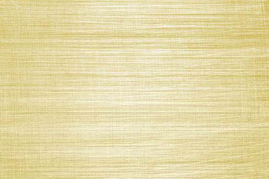 Golden texture of shiny scratched metal. Abstract gold background. photo