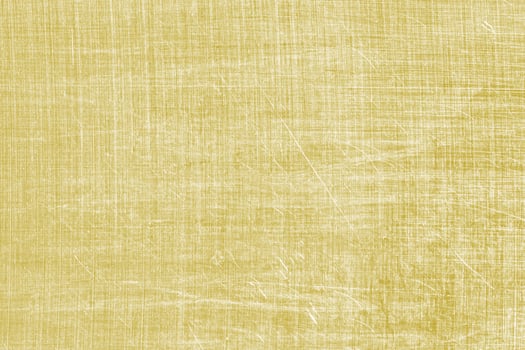 Golden texture of shiny scratched metal. Abstract gold background. photo