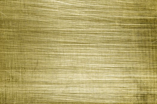 Golden texture of shiny scratched metal. Abstract gold background. photo