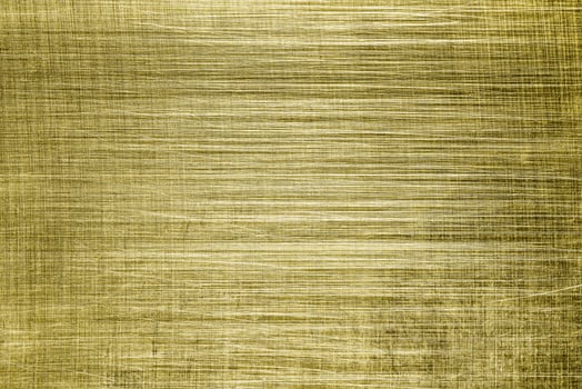 Golden texture of shiny scratched metal. Abstract gold background. photo