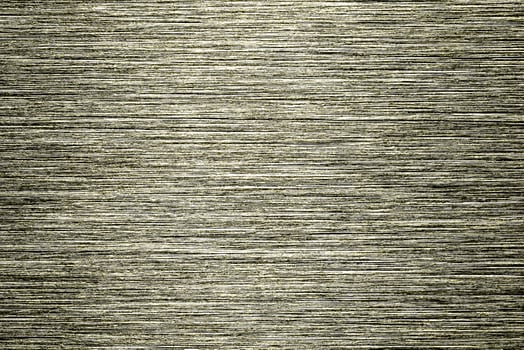 Golden texture of shiny scratched metal. Abstract gold background. photo