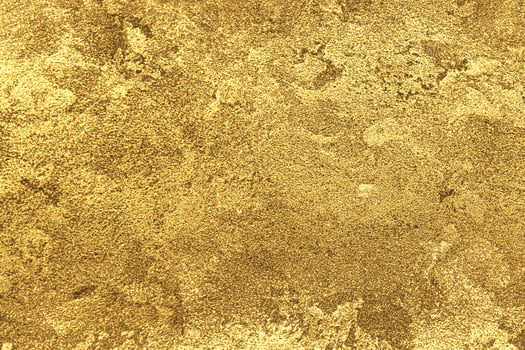 Texture of golden decorative plaster or concrete. Abstract gold grunge background. photo