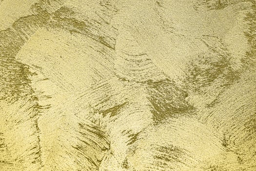Texture of golden decorative plaster or concrete. Abstract gold grunge background. photo