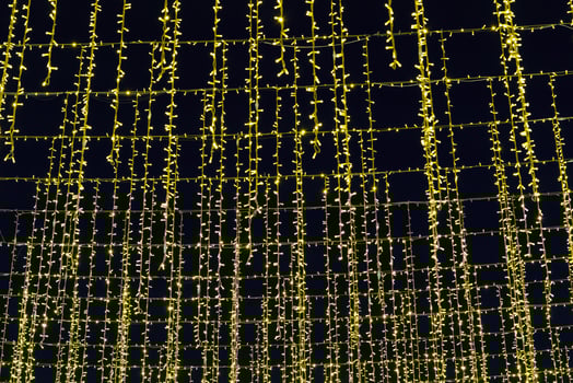 Festive hanging LED garlands against the background of the night sky. photo