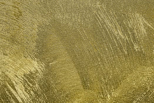 Texture of golden decorative plaster or concrete. Abstract gold grunge background. photo