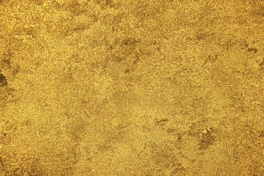 Texture of golden decorative plaster or concrete. Abstract gold grunge background. photo