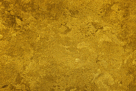 Texture of golden decorative plaster or concrete. Abstract gold grunge background. photo