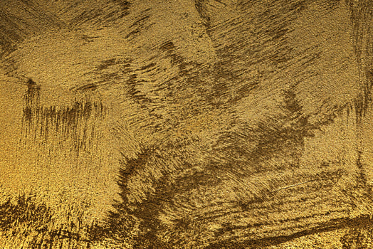 Texture of golden decorative plaster or concrete. Abstract gold grunge background. photo