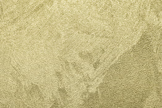 Texture of golden decorative plaster or concrete. Abstract gold grunge background. photo