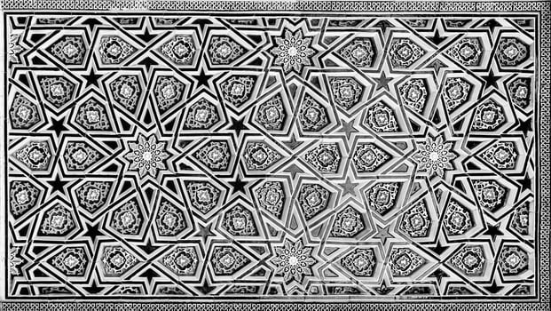 Geometric traditional Islamic ornament. Fragment of a ceramic mosaic. Black and white. photo