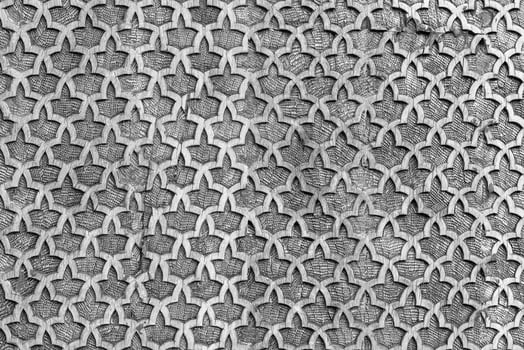 Fragment of an ancient carved wooden pattern. Ornate. Abstract background. Black and white. photo