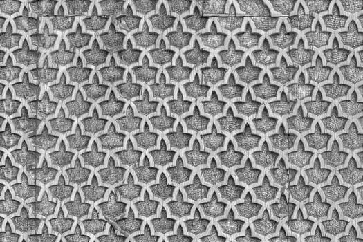 Fragment of an ancient carved wooden pattern. Ornate. Abstract background. Black and white. photo