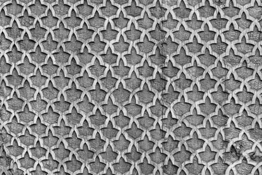 Fragment of an ancient carved wooden pattern. Ornate. Abstract background. Black and white. photo