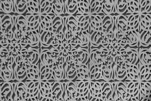 Geometric traditional Islamic ornament. Fragment of a concrete mosaic. Black and white. photo