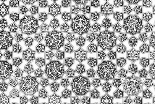 Geometric traditional Islamic ornament. Fragment of a ceramic mosaic. Black and white. photo