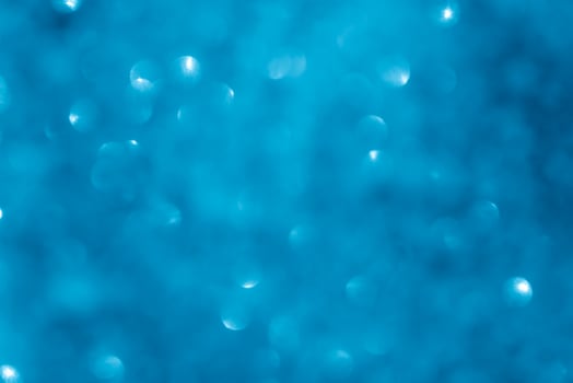 Turquoise lights bokeh background. Blue lights. photo