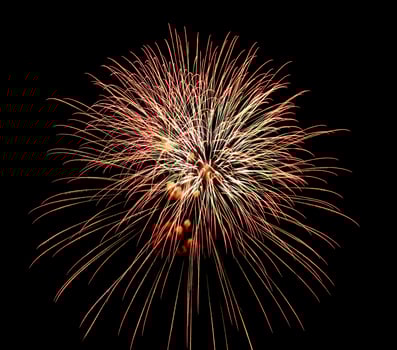 Colorful celebration fireworks isolated on a black sky background. photo
