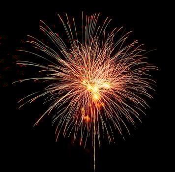 Colorful celebration fireworks isolated on a black sky background. photo
