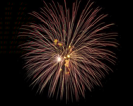 Colorful celebration fireworks isolated on a black sky background. photo
