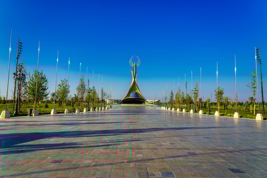 UZBEKISTAN, TASHKENT - APRIL 25, 2023 Monument of Independence in the form of a stele with a Humo bird against a blue sky in the New Uzbekistan park. photo