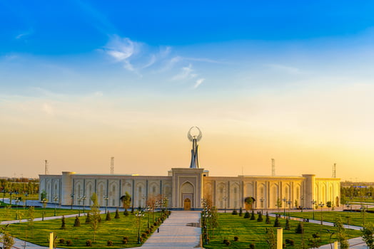 UZBEKISTAN, TASHKENT - APRIL 25, 2023 The territory of the park New Uzbekistan with Monument of Independence in the form of a stele with a Humo bird at twilight. photo