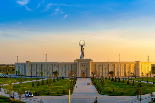 UZBEKISTAN, TASHKENT - APRIL 25, 2023 The territory of the park New Uzbekistan with Monument of Independence in the form of a stele with a Humo bird at twilight. photo