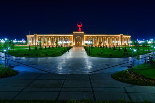 UZBEKISTAN, TASHKENT - APRIL 25, 2023 The territory of the park New Uzbekistan with Monument of Independence in the form of a stele with a Humo bird at night. photo