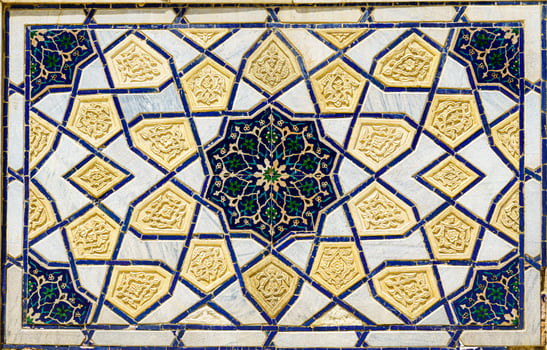 Geometric traditional Islamic ornament. Fragment of a ceramic mosaic. photo