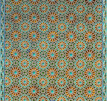 Geometric traditional Islamic ornament. Fragment of a ceramic mosaic. photo