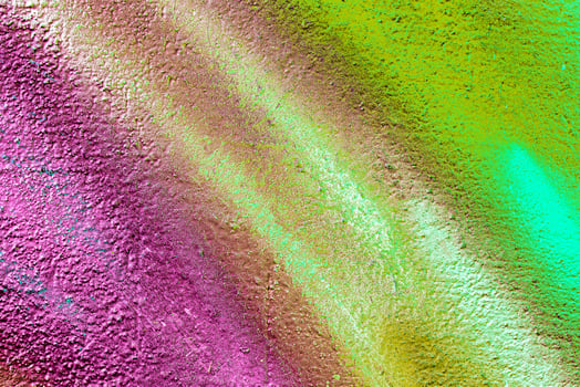 Colorful graffiti painted on a wall. Abstract urban background. Spray painting art. photo