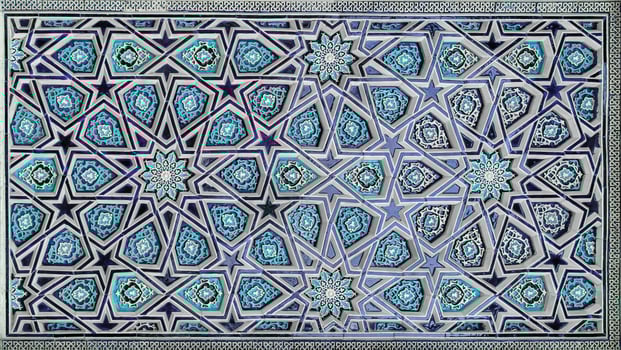 Geometric traditional Islamic ornament. Fragment of a ceramic mosaic. photo
