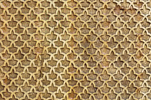 Fragment of an ancient carved wooden pattern. Ornate. Abstract background. photo