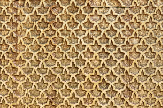 Fragment of an ancient carved wooden pattern. Ornate. Abstract background. photo