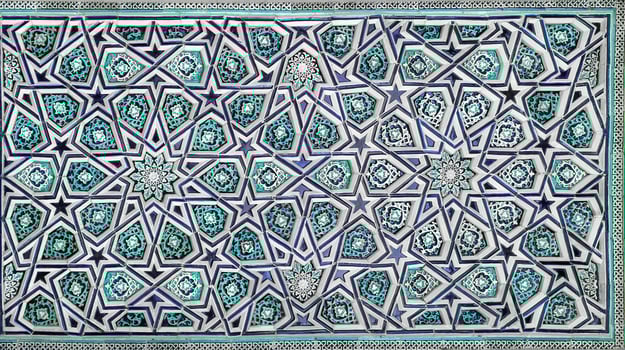 Geometric traditional Islamic ornament. Fragment of a ceramic mosaic. photo