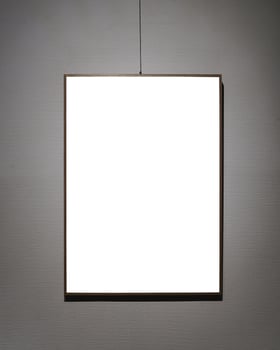 Picture frames with copy space for text hanging on the wall with wallpaper. Mockup for design. photo
