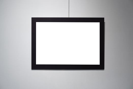 Picture frames with copy space for text hanging on the wall with wallpaper. Mockup for design. photo