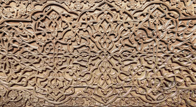 Fragment of an ancient carved wooden door. Ornate. photo