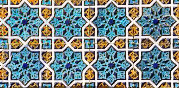 Geometric traditional Islamic ornament. Fragment of a ceramic mosaic. photo